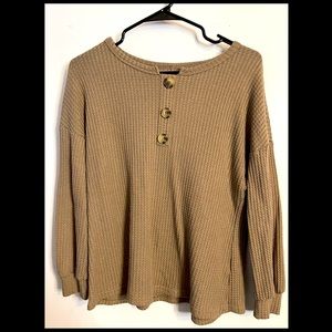 A medium, tan, very cute, sweater.